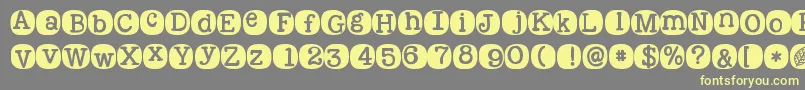 Kgwakemeup-Schriftart – Gelbe Schriften auf grauem Hintergrund