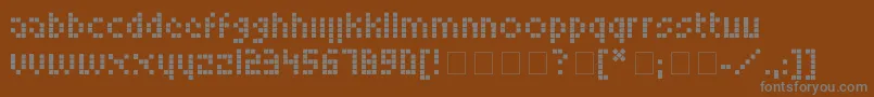LookskyFont-fontti – harmaat kirjasimet ruskealla taustalla