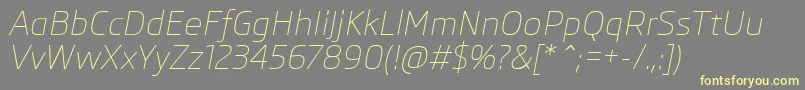フォントSkodaProLightItalic – 黄色のフォント、灰色の背景