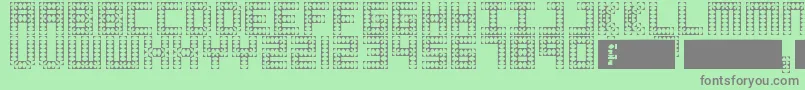 フォントCosmo – 緑の背景に灰色の文字