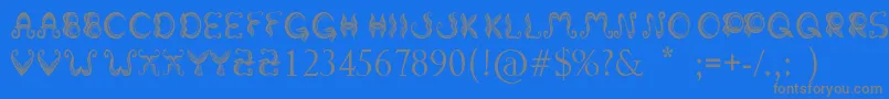 フォントStrokeMustache – 青い背景に灰色の文字
