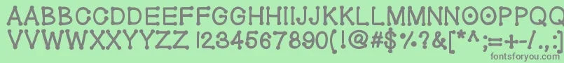 フォントGeldoticathickf – 緑の背景に灰色の文字