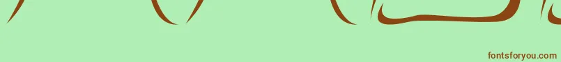 フォントNecrophylac – 緑の背景に茶色のフォント