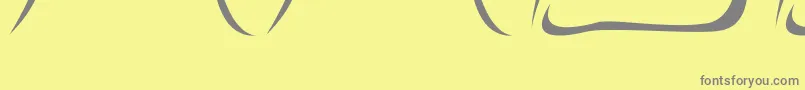フォントNecrophylac – 黄色の背景に灰色の文字