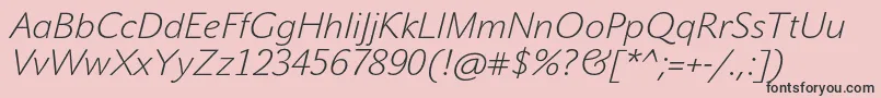 フォントJohnsansWhiteProItalic – ピンクの背景に黒い文字