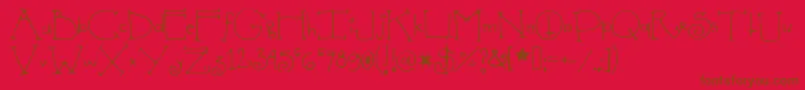 Shedevil-Schriftart – Braune Schriften auf rotem Hintergrund