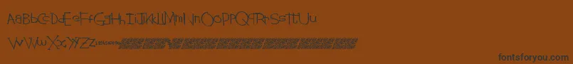 Stringtheory-Schriftart – Schwarze Schriften auf braunem Hintergrund