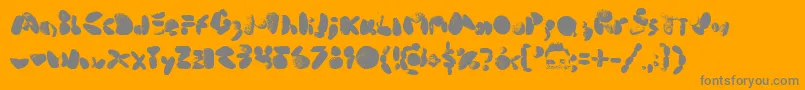 Fonte MiddleCoveBeachRocks1.0 – fontes cinzas em um fundo laranja