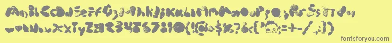 MiddleCoveBeachRocks1.0-Schriftart – Graue Schriften auf gelbem Hintergrund