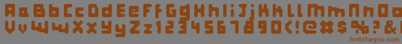 フォントFatpixel – 茶色の文字が灰色の背景にあります。