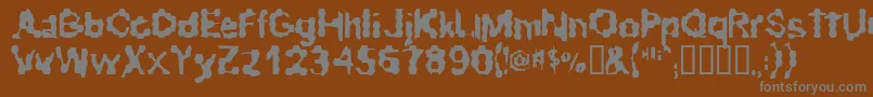 RibbedRoughRider-Schriftart – Graue Schriften auf braunem Hintergrund