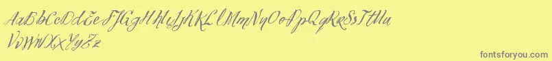 フォントVtksFelicidade2016 – 黄色の背景に灰色の文字