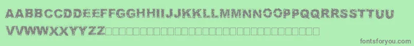 フォントFuzzed – 緑の背景に灰色の文字