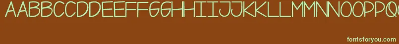 Weitere Informationen zur Xii-Schriftart Xii-Schriftart – Grüne Schriften auf braunem Hintergrund