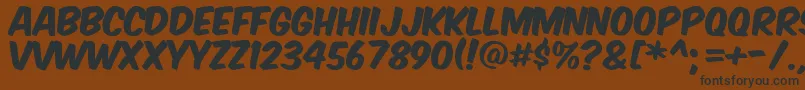 Komikax Font – Black Fonts on Brown Background