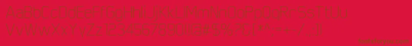 ScriberThin-Schriftart – Braune Schriften auf rotem Hintergrund
