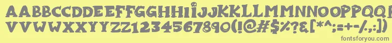 フォントZombiebites – 黄色の背景に灰色の文字