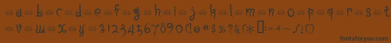 フォントFuuRegularE. – 黒い文字が茶色の背景にあります