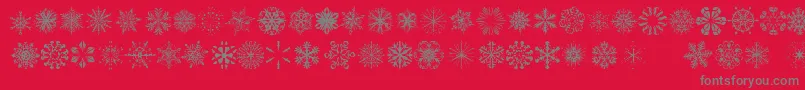 SnowflakesTfb-Schriftart – Graue Schriften auf rotem Hintergrund