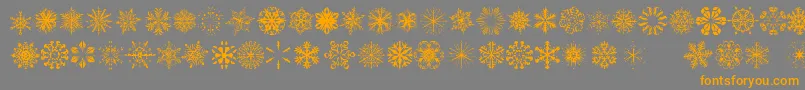 SnowflakesTfb-fontti – oranssit fontit harmaalla taustalla