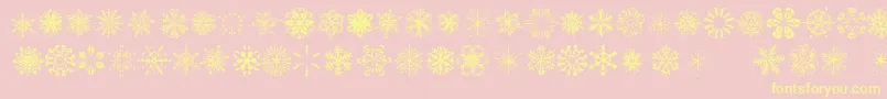 SnowflakesTfb-fontti – keltaiset fontit vaaleanpunaisella taustalla