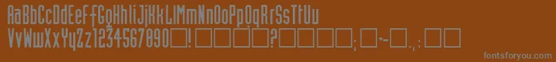 Neutworegular-fontti – harmaat kirjasimet ruskealla taustalla