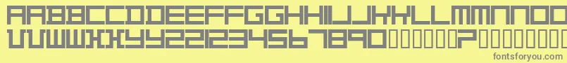 TheoVanDoesburg-fontti – harmaat kirjasimet keltaisella taustalla