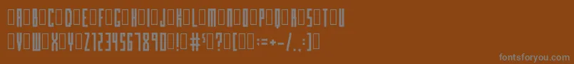 BloxcondensedRegular-fontti – harmaat kirjasimet ruskealla taustalla