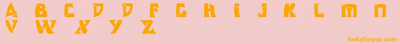 フォントOdishisw – オレンジの文字がピンクの背景にあります。