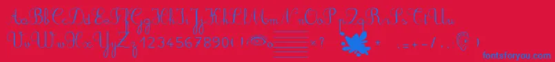 Ducahier2CursiveScolaire-Schriftart – Blaue Schriften auf rotem Hintergrund