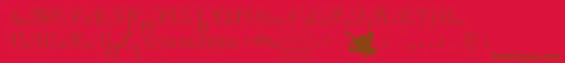 Ducahier2CursiveScolaire-Schriftart – Braune Schriften auf rotem Hintergrund