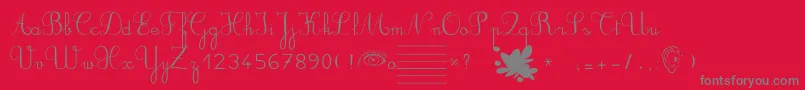 Ducahier2CursiveScolaire-Schriftart – Graue Schriften auf rotem Hintergrund