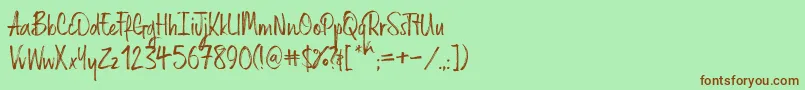 フォントRussellrg – 緑の背景に茶色のフォント