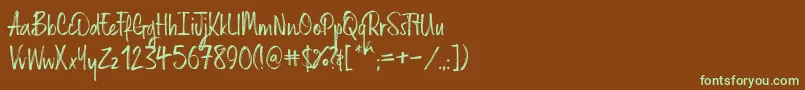 フォントRussellrg – 緑色の文字が茶色の背景にあります。