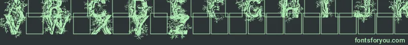 Czcionka Deepwoodsinitials – zielone czcionki na czarnym tle