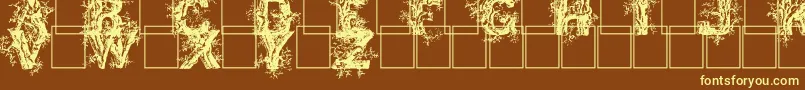 Шрифт Deepwoodsinitials – жёлтые шрифты на коричневом фоне
