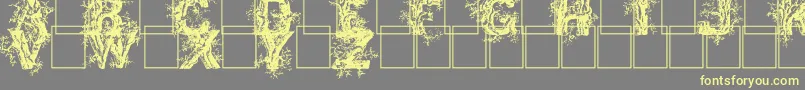 Deepwoodsinitials Font – Yellow Fonts on Gray Background