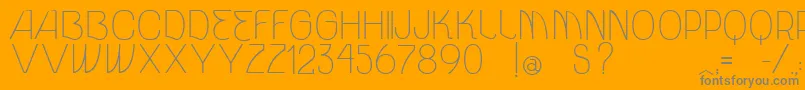 VtksUnidade-Schriftart – Graue Schriften auf orangefarbenem Hintergrund