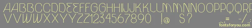 VtksUnidade Font – Yellow Fonts on Gray Background