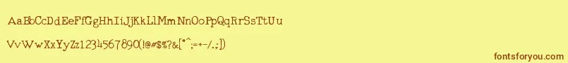 Шрифт RmTyperighterOld – коричневые шрифты на жёлтом фоне