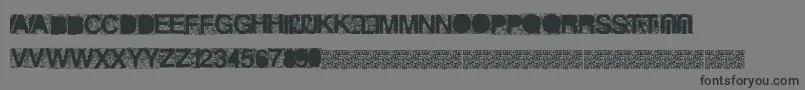 Heckagrunge-Schriftart – Schwarze Schriften auf grauem Hintergrund