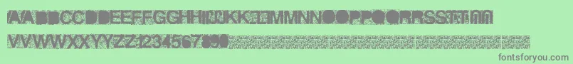 Heckagrunge-Schriftart – Graue Schriften auf grünem Hintergrund