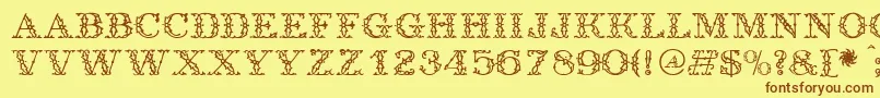 フォントAntique – 茶色の文字が黄色の背景にあります。