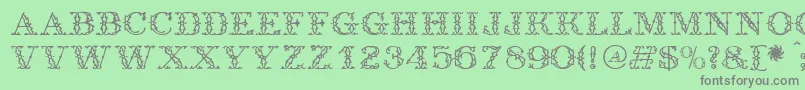フォントAntique – 緑の背景に灰色の文字