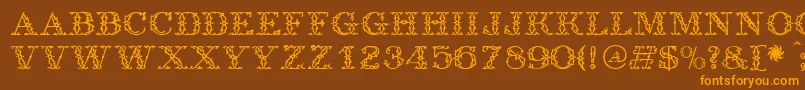 フォントAntique – オレンジ色の文字が茶色の背景にあります。