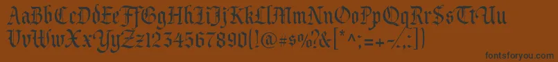 Prince-Schriftart – Schwarze Schriften auf braunem Hintergrund