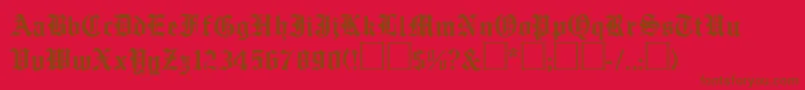 EmilcobRegular-Schriftart – Braune Schriften auf rotem Hintergrund