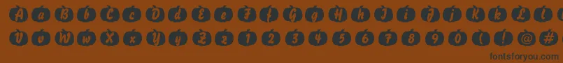 Pumpkin-Schriftart – Schwarze Schriften auf braunem Hintergrund