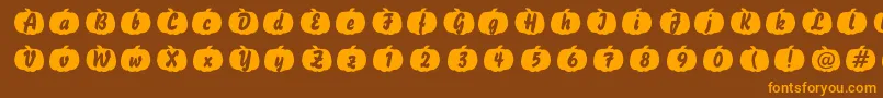 フォントPumpkin – オレンジ色の文字が茶色の背景にあります。