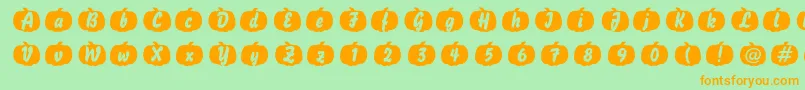 フォントPumpkin – オレンジの文字が緑の背景にあります。